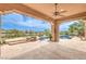 Covered patio area with a pool and spa in a beautifully landscaped backyard at 5162 Estasi St, Las Vegas, NV 89135