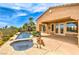Beautiful pool and spa with rock features, adjacent to the home's patio at 5162 Estasi St, Las Vegas, NV 89135