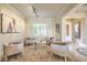 Cozy sitting area with neutral colors, a stylish rug, comfortable chairs, and ample natural light at 5162 Estasi St, Las Vegas, NV 89135
