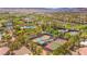Aerial view of tennis and pickleball courts in a well-maintained community with mountain views at 5162 Estasi St, Las Vegas, NV 89135