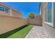 Private backyard with low-maintenance turf and paver patio, perfect for relaxing and entertaining at 5244 Fiery Sky Ridge St, Las Vegas, NV 89148
