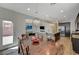 Dining area with a view to the kitchen, open concept living room, and access to the backyard at 5244 Fiery Sky Ridge St, Las Vegas, NV 89148