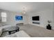 Comfortable living room featuring modern decor, a wall-mounted TV, and an open layout, ideal for gatherings at 5244 Fiery Sky Ridge St, Las Vegas, NV 89148