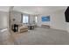 Bright and open living room with modern decor, large windows, and a cozy seating area at 5244 Fiery Sky Ridge St, Las Vegas, NV 89148