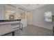 Well-lit loft featuring a built-in desk, neutral walls, and natural light from the window at 5244 Fiery Sky Ridge St, Las Vegas, NV 89148