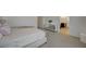 Main bedroom with bed, end table, and doorway leading to en-suite bathroom at 5244 Fiery Sky Ridge St, Las Vegas, NV 89148