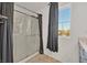 Bathroom featuring a glass-enclosed shower and a bright window at 5250 Chester Creek Ct, Las Vegas, NV 89141