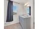 Bathroom featuring double sinks, a large mirror, and stylish vanity lighting at 5250 Chester Creek Ct, Las Vegas, NV 89141