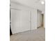 Bright bedroom with double door closet, ceiling fan, and neutral carpet at 5250 Chester Creek Ct, Las Vegas, NV 89141