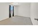 Spacious bedroom with a large window, neutral walls, and plush carpet at 5250 Chester Creek Ct, Las Vegas, NV 89141
