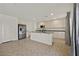 Spacious kitchen features stainless appliances, granite countertops, and ample white cabinetry for storage at 5250 Chester Creek Ct, Las Vegas, NV 89141