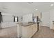 Open-concept kitchen with granite countertops, stainless steel appliances, and a view to the adjacent living room at 5250 Chester Creek Ct, Las Vegas, NV 89141