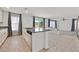 Modern kitchen with granite countertops, stainless steel dishwasher, and sliding doors providing outdoor views at 5250 Chester Creek Ct, Las Vegas, NV 89141