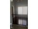 Bright living room featuring a large window and modern window treatment at 5389 Spencer St, Las Vegas, NV 89119