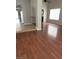 Bright living room featuring laminate floors, neutral paint, and natural light from the window at 5389 Spencer St, Las Vegas, NV 89119
