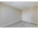 Bedroom with neutral paint, grey vinyl flooring and contemporary lighting at 555 E Silverado Ranch Blvd # 2164, Las Vegas, NV 89183