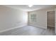 Spacious bedroom featuring stylish gray wood-look floors and a walk-in closet at 555 E Silverado Ranch Blvd # 2164, Las Vegas, NV 89183