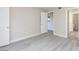 Bright bedroom with light gray wood-look floors and views of other rooms at 555 E Silverado Ranch Blvd # 2164, Las Vegas, NV 89183