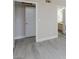 Bedroom with wood-look floors; features view to walk-in closet and partial view of ensuite bathroom at 555 E Silverado Ranch Blvd # 2164, Las Vegas, NV 89183
