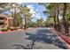 Well-maintained community entrance with manicured landscaping and gated access for residents at 555 E Silverado Ranch Blvd # 2164, Las Vegas, NV 89183