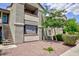 Multi-level apartment building exterior with landscaping, stairs and balconies at 555 E Silverado Ranch Blvd # 2164, Las Vegas, NV 89183