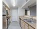 Well-lit kitchen with stainless steel appliances and ample counter space at 555 E Silverado Ranch Blvd # 2164, Las Vegas, NV 89183