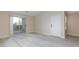 Inviting living area with vinyl floors and balcony access for seamless indoor-outdoor living at 555 E Silverado Ranch Blvd # 2164, Las Vegas, NV 89183