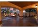 Covered patio with cozy seating around a fire pit, perfect for outdoor relaxation at 5779 Baffy Cir, Las Vegas, NV 89142