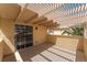 Spacious covered balcony area offers protection from sun with view of backyard at 5779 Baffy Cir, Las Vegas, NV 89142