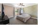 Bedroom with a sliding glass door to the outside and a ceiling fan at 5779 Baffy Cir, Las Vegas, NV 89142