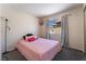Bedroom features a cozy bed, bright window, and stylish curtains at 5779 Baffy Cir, Las Vegas, NV 89142