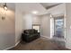 Versatile bonus room with a comfortable sofa and a view, ideal for relaxation or a home office at 5779 Baffy Cir, Las Vegas, NV 89142