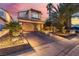 Charming two-story home features a well-manicured yard and spacious driveway at 5779 Baffy Cir, Las Vegas, NV 89142