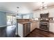 Well-appointed kitchen with stainless steel appliances and granite countertops open to dining area at 5779 Baffy Cir, Las Vegas, NV 89142