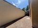 Exterior view of house with backyard space and block wall at 5861 Varese Dr, Las Vegas, NV 89141