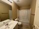 Well-lit bathroom featuring a shower-tub combo, updated vanity, and neutral tile flooring at 5861 Varese Dr, Las Vegas, NV 89141
