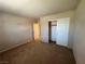 Bedroom with carpet floors, closet with sliding doors, and neutral walls at 5861 Varese Dr, Las Vegas, NV 89141