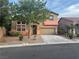 Charming two-story home with desert landscaping, covered porch, and two-car garage at 5861 Varese Dr, Las Vegas, NV 89141
