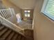 High-ceiling foyer featuring a chandelier, stairwell with white banister, and natural light from windows at 5861 Varese Dr, Las Vegas, NV 89141