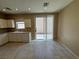 Bright kitchen with white cabinets, tile flooring, and stainless steel appliances at 5861 Varese Dr, Las Vegas, NV 89141