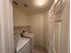 Laundry room with washer, dryer, shelving, and white door at 5861 Varese Dr, Las Vegas, NV 89141
