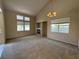 Open living room featuring high ceilings, a fireplace, and ample natural light from large windows at 5861 Varese Dr, Las Vegas, NV 89141