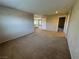 Upstairs loft featuring neutral walls, carpet flooring, and an open layout leading to other rooms at 5861 Varese Dr, Las Vegas, NV 89141