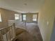 Upstairs loft featuring carpet and two windows providing natural light at 5861 Varese Dr, Las Vegas, NV 89141