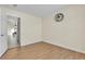 Clean and bright bedroom with hardwood floors and a large doorway at 5990 Ablette Ave, Las Vegas, NV 89122