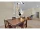 Dining area with tile floors, ceiling fans and easy access to living area at 5990 Ablette Ave, Las Vegas, NV 89122
