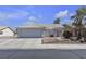 Charming single-story home with a tiled roof, desert landscaping, and a spacious two-car garage at 5990 Ablette Ave, Las Vegas, NV 89122