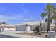 Lovely home with tiled roof, desert landscaping, two-car garage and mature palm trees at 5990 Ablette Ave, Las Vegas, NV 89122