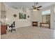 Living room featuring a cozy fireplace, tile flooring, and access to outdoor space at 5990 Ablette Ave, Las Vegas, NV 89122