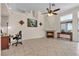 Cozy living area with fireplace, tile floors, and natural light from large windows at 5990 Ablette Ave, Las Vegas, NV 89122